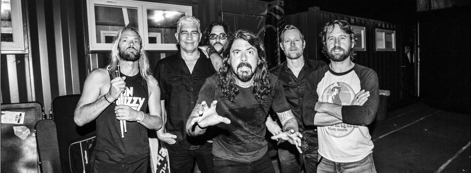 foo fighters portrait of the band in black and white. Fans protested vaccination requirements outside of a performance in California this week