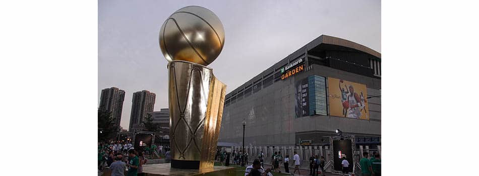 Fans stand outside of Boston's TD Garden alongside a giant replica of the NBA championship trophy in 2008. The Celtics and Golden State Warriors are playing in the NBA Finals tonight and tickets are very expensive.