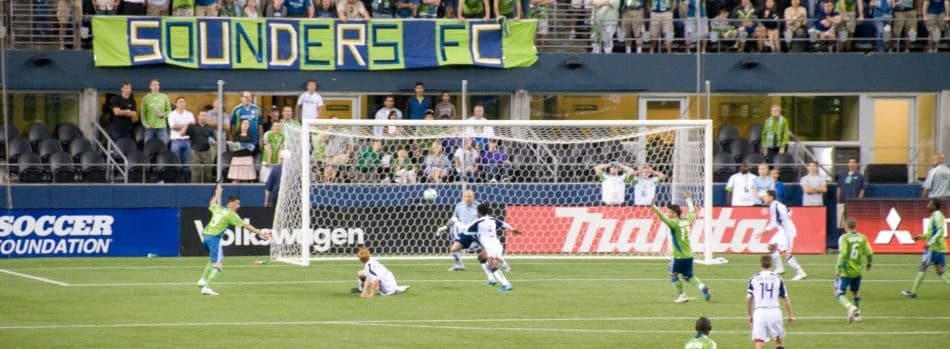 Seattle Sounders FC - players working on the field with fans in the background