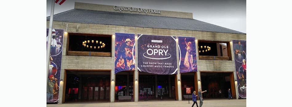 Garth Brooks will perform at Opry House in November (external photo of the venue with two pedestrians walking nearby)